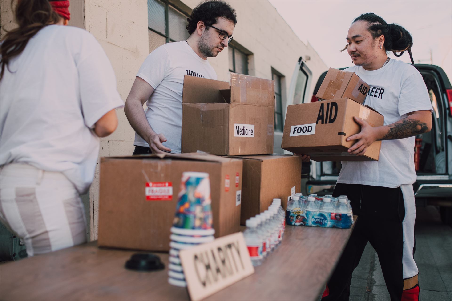 Volunteers packing food parcels together