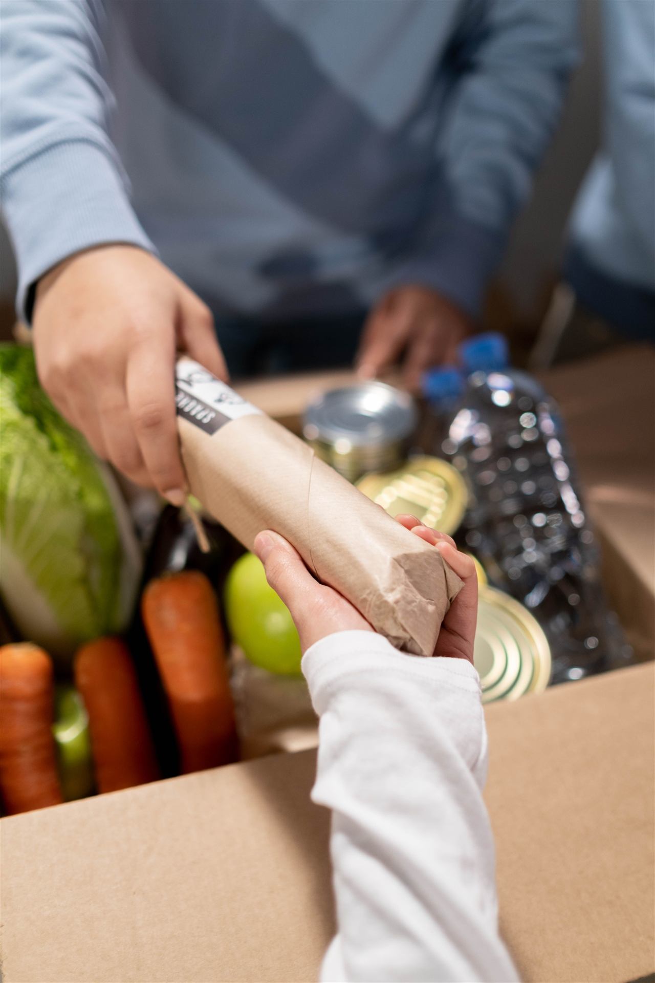 Volunteer delivering a food parcel